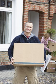Local movers loading office furniture during a commercial collection in Movingservices