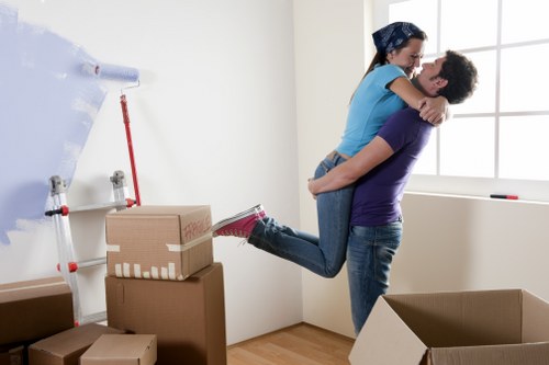 Movingservices team preparing a safe relocation with packed boxes and protective equipment