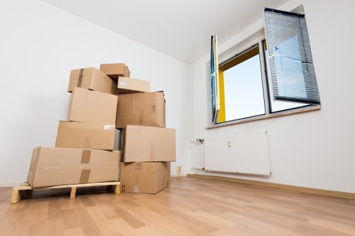 Professional moving team loading furniture into a removals van