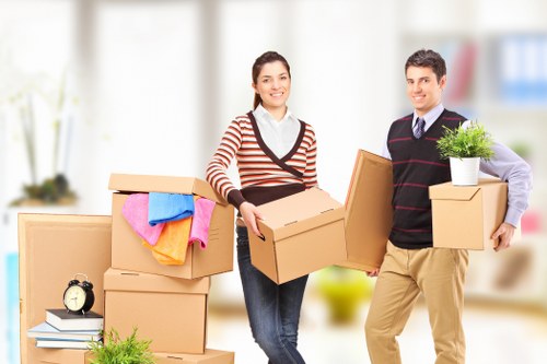 Loading furniture into a hired removal truck for a residential relocation