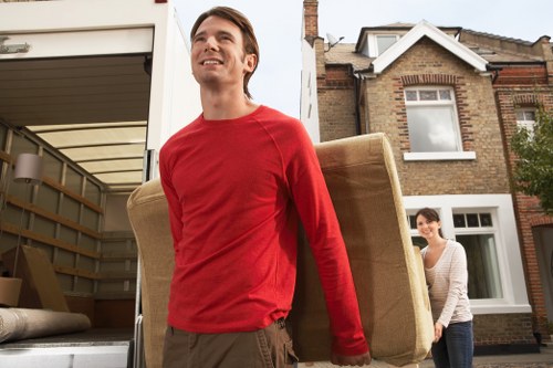 House removalists unloading boxes into a new local home