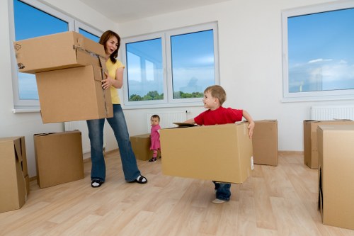 Moving team loading furniture into a van in a residential area