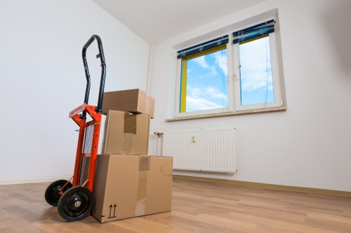 Moving team handling furniture and boxes during a local home move