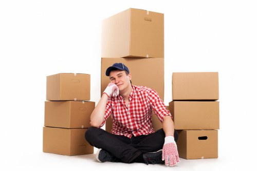 Business moving essentials including packing materials, desks, and storage items